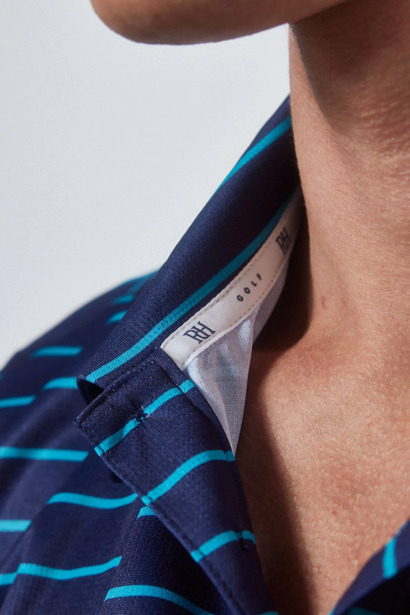 GOLF striped technical polo shirt