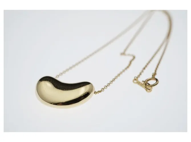 Tiffany & Co TIFFANY Y COMPAÑIA. Colgante Elsa Peretti Bean Design 18K Oro Dorado Gold hardware 