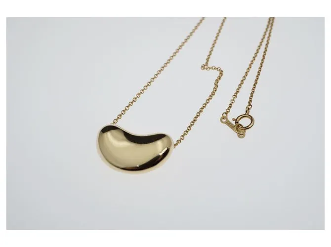 Tiffany & Co TIFFANY Y COMPAÑIA. Colgante Elsa Peretti Bean Design 18K Oro Dorado Gold hardware 