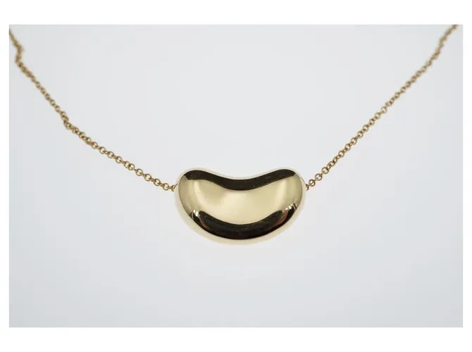 Tiffany & Co TIFFANY Y COMPAÑIA. Colgante Elsa Peretti Bean Design 18K Oro Dorado Gold hardware 