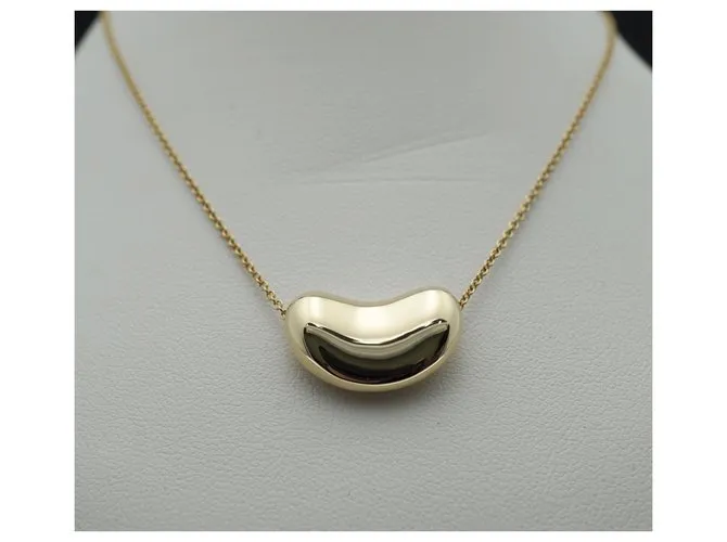 Tiffany & Co TIFFANY Y COMPAÑIA. Colgante Elsa Peretti Bean Design 18K Oro Dorado Gold hardware 