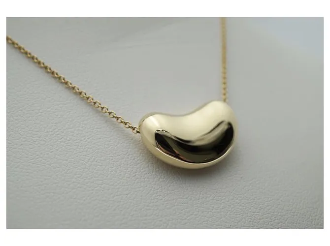 Tiffany & Co TIFFANY Y COMPAÑIA. Colgante Elsa Peretti Bean Design 18K Oro Dorado Gold hardware 