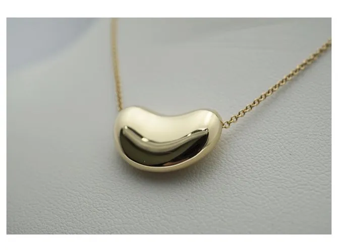 Tiffany & Co TIFFANY Y COMPAÑIA. Colgante Elsa Peretti Bean Design 18K Oro Dorado Gold hardware 