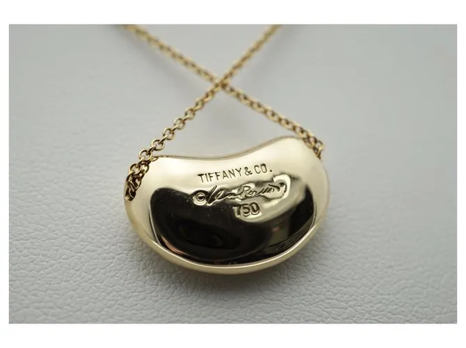 Tiffany & Co TIFFANY Y COMPAÑIA. Colgante Elsa Peretti Bean Design 18K Oro Dorado Gold hardware 