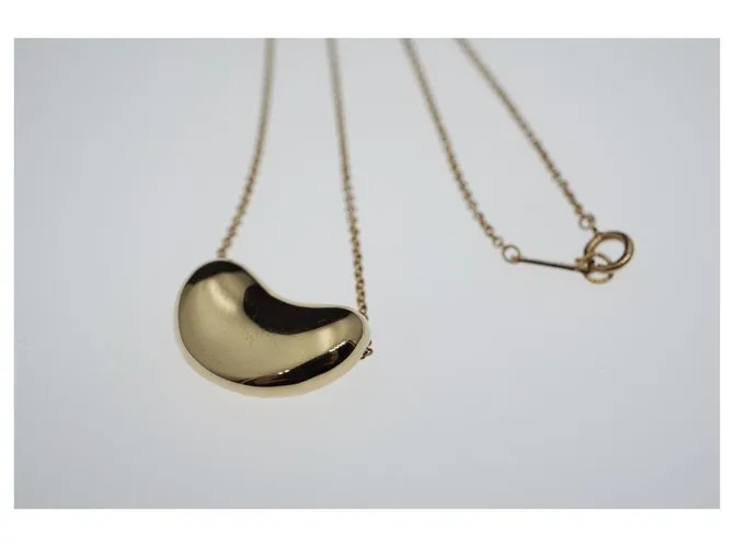 Tiffany & Co TIFFANY Y COMPAÑIA. Colgante Elsa Peretti Bean Design 18K Oro Dorado Gold hardware 